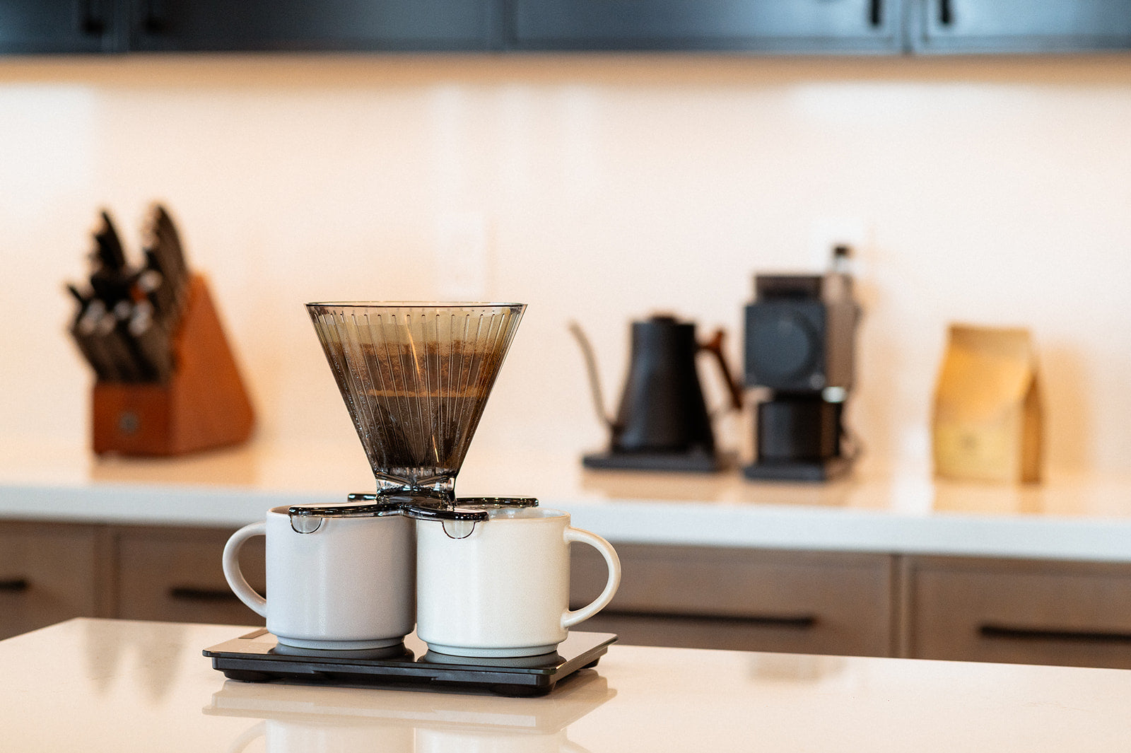Divvi Dripper resting on Two Even mugs